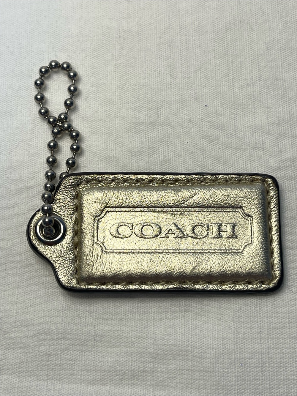 COACH Metallic Gold Leather Hang Tag with Ball Chain